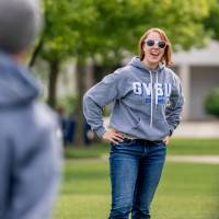 A player smiles and laughs wearing sunglasses